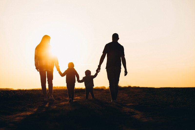 emotional advertising, family walking on beach